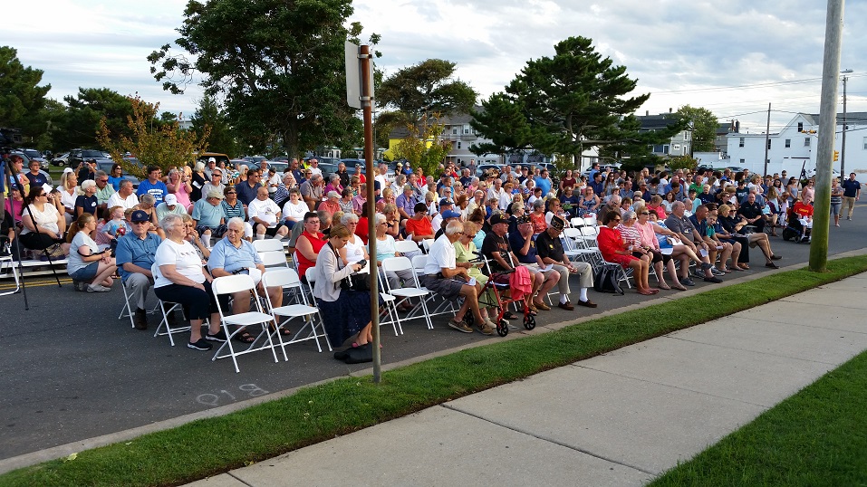 Hundreds of people watched the ceremony from a closed-off portion of Asbury Avenue in front of the fire headquarters.