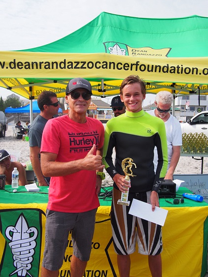 Evan Couval, 14, of Brigantine receives his first-place trophy for the boys division at the 16th annual Surf for a Cause in Margate.