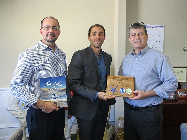 Clean Ocean Action Coastal Policy Attorney Zach Lees (center) presents Municipal Blue Star Certification to Ocean City Finance Director Frank Donato (left) and Ocean City Business Administrator Jim Mallon on Oct. 11, 2016. Ocean City is the first Cape May County town to achieve the honor.