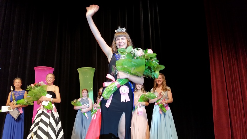 Schwartz waves to the audience at the William and Nancy Hughes Performing Arts Center at Ocean City High School.