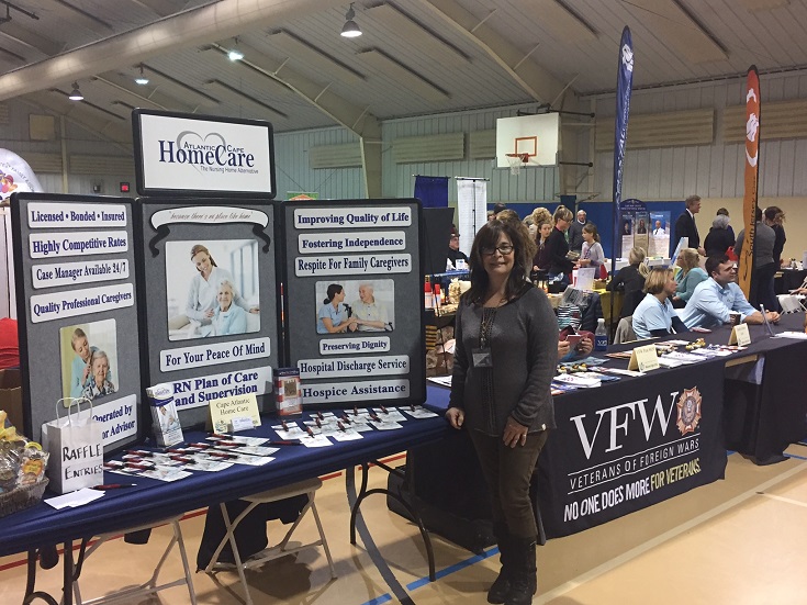 Atlantic Cape Home Care's Paula Popilock greets visitors at Welcome Night.