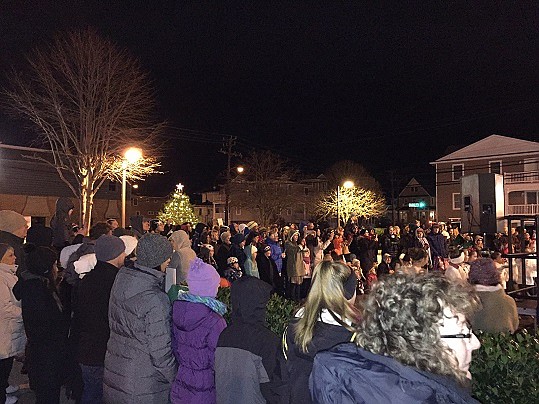 A large crowd surrounded the stage and filled the parking lot. They watched the performances and enjoyed all the holiday spirit. 