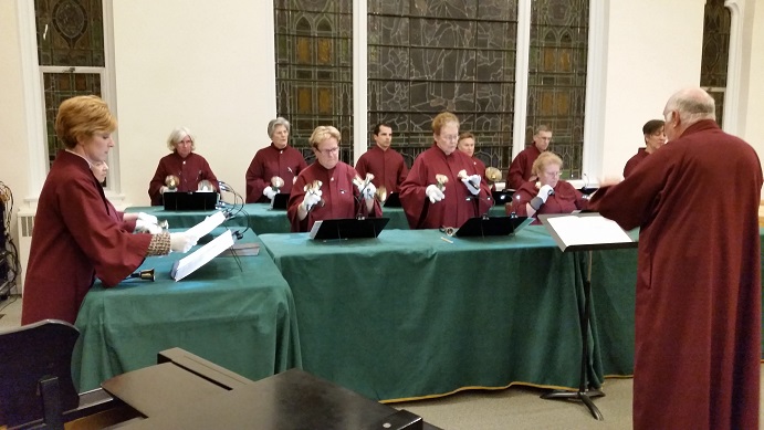 The white-gloved members of the Bell Choir of St. Peter's performed 