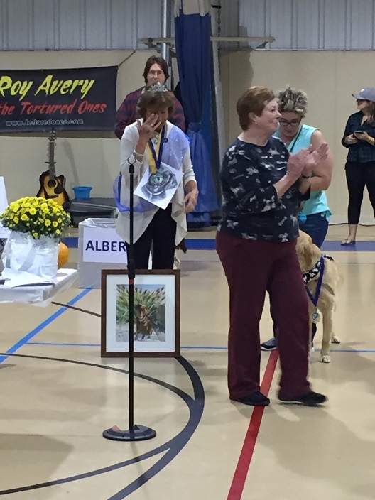 Mocha's owner, Sue Bechtold with MC Susan Niskanen and 1st Runner-up P.W. Scrubbs