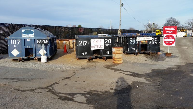 Dumpsters are used to hold paper, bottles, cans and other recycled items.