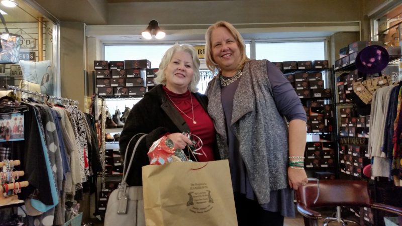 Customer Agnes Jonczak, of Bensalem, Pa., joins Voudouri at the shops. She bought some gifts for herself and her family.