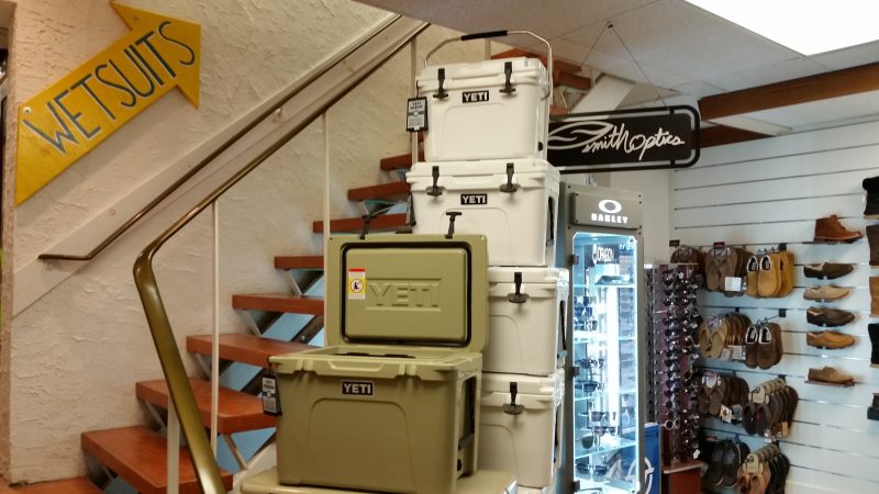 Yeti coolers are stacked on top of each other in a store display.