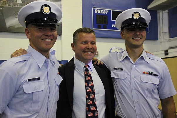 Herb Godfrey is flanked by his sons, Herbie and Townie, earlier this year at Townie's graduation. 