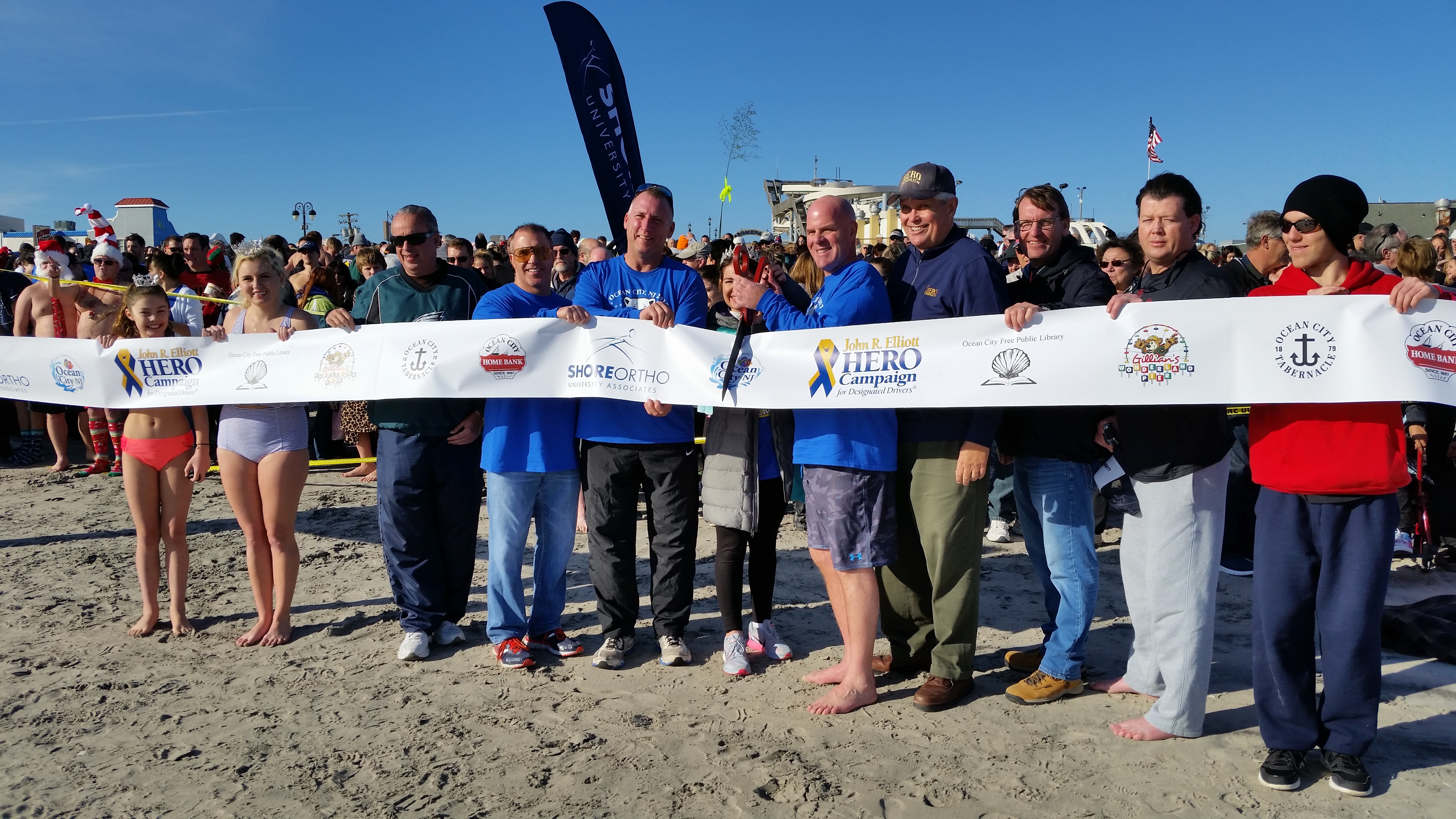 Dignitaries cut the ceremonial ribbon for the event, which benefited the John R. Elliott HERO Campaign for Designated Drivers.