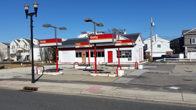 Plans call for demolishing the old Getty gas station and transforming the site into a park after the city buys it.