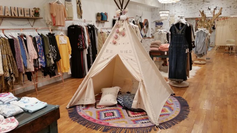 A tepee that serves as a children's play area is one of the decorative centerpieces of the shop.