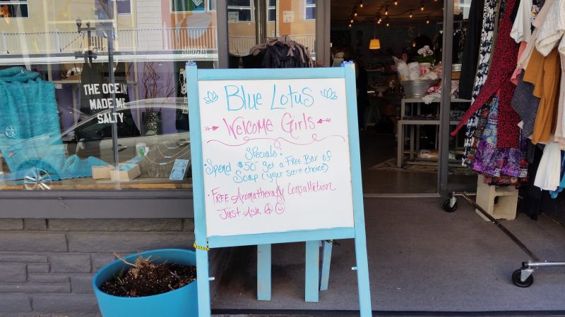 A sign outside the Blue Lotus boutique on Asbury Avenue says 