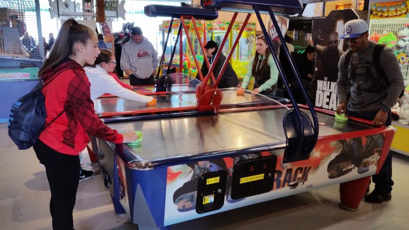 Air hockey is one of the old-style games in Playland's arcade.