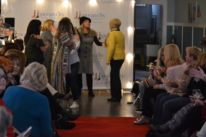 Audience members eagerly waiting for the show to start.