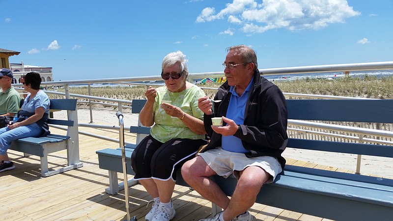 Tourists Elaine Titus and Brian Stockton, of Carneys Point, Salem County, enjoy a gelato while soaking up the sun on the Boardwalk.