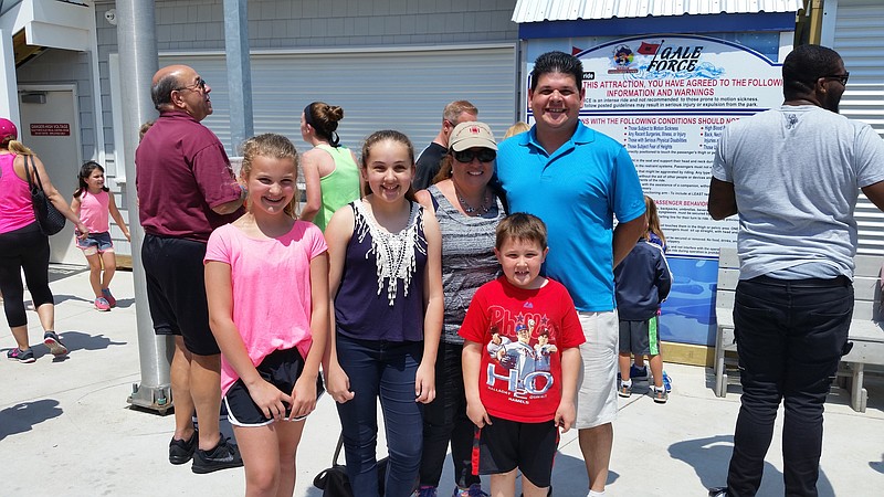 The Shephard family and their friend, Mya Coupe, left, enjoyed both riding the coaster and watching it from the ground.