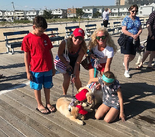 The Rossiter and Audino families participated with their patriotically pups.  These two goldens are brothers and are a handful of fun.