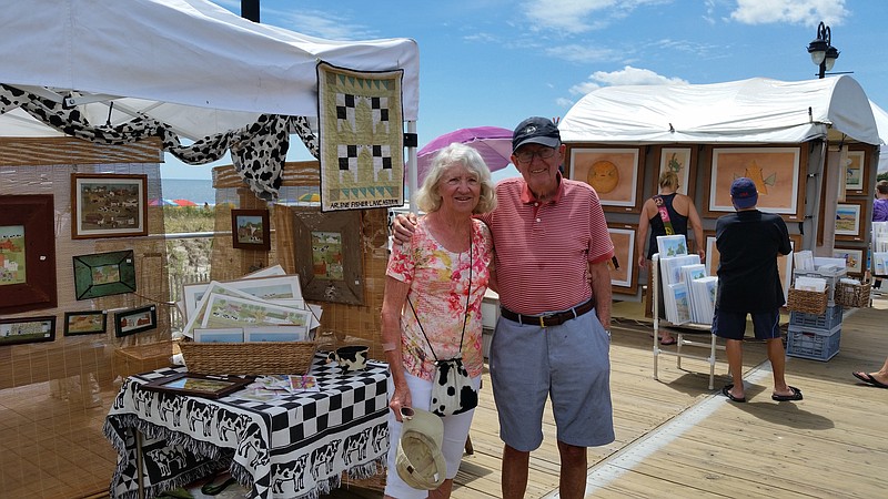 Painter Arlene Fisher, joined by her husband, Bill, has been a fixture at the art show for  45 years.