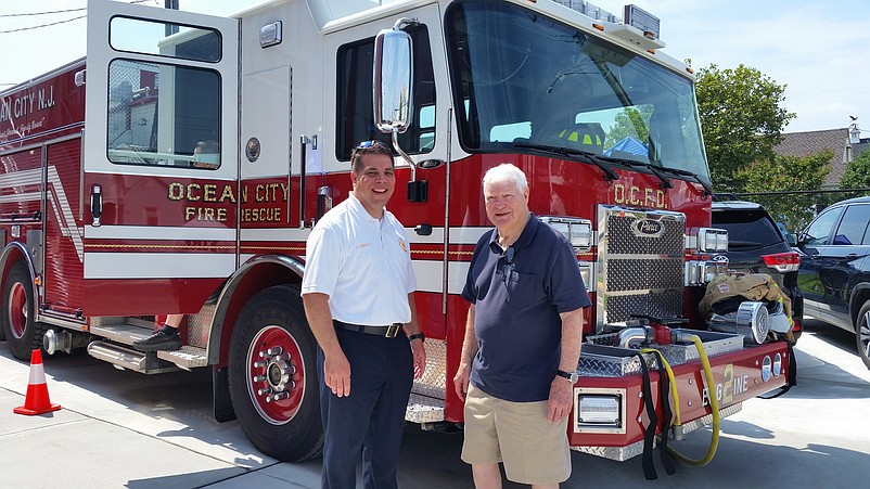 Fire Chief Jim Smith, left, celebrates with former Fire Chief Robert Hart, who was the guest of honor at the open house.