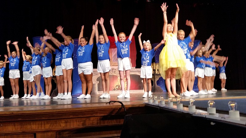 Miss Little Ocean City 2017 Charlotte Erickson, in yellow dress, leads the contestants in the pageant's opening number.