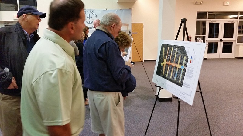 At Thursday night's meeting, residents looked at renderings that showed the lagoons scheduled to be dredged this year.