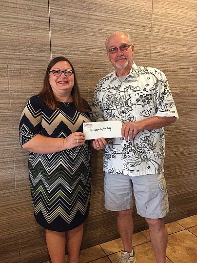 Sturdy Savings Bank Somers Point Branch Manager Jane Alvarez presents Walter Gregory, Treasurer of the Somers Point Historical Society, with a sponsorship check for the annual “Horsepower by the Bay” car show. Photo Credit: Sturdy Savings Bank