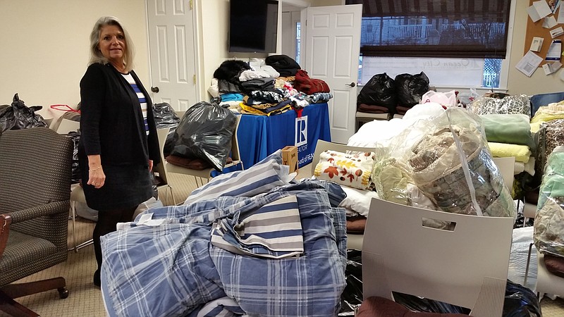 Votta stands amid a roomful of donated items awaiting distribution to members of the Ocean City community.