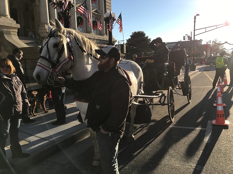 Horse and carriage rides add to the festive holiday atmosphere.