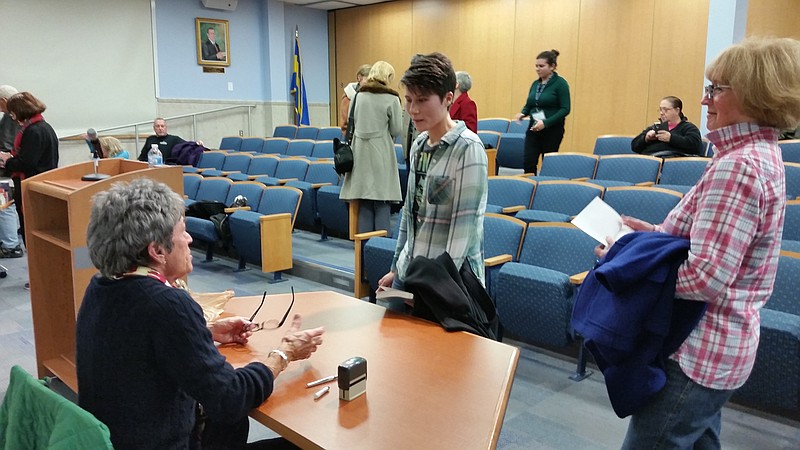 Kim Koernig, center, an Ocean City resident and aspiring writer, shares some words with Brown.