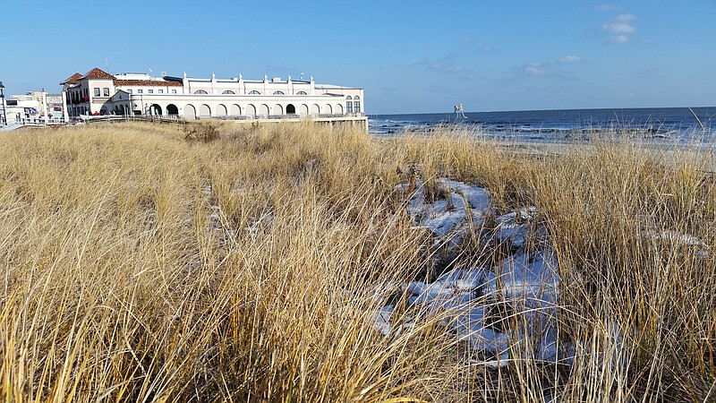 With the Music Pier in the background, the dunes are sprinkled with snow to create a wintry scene.