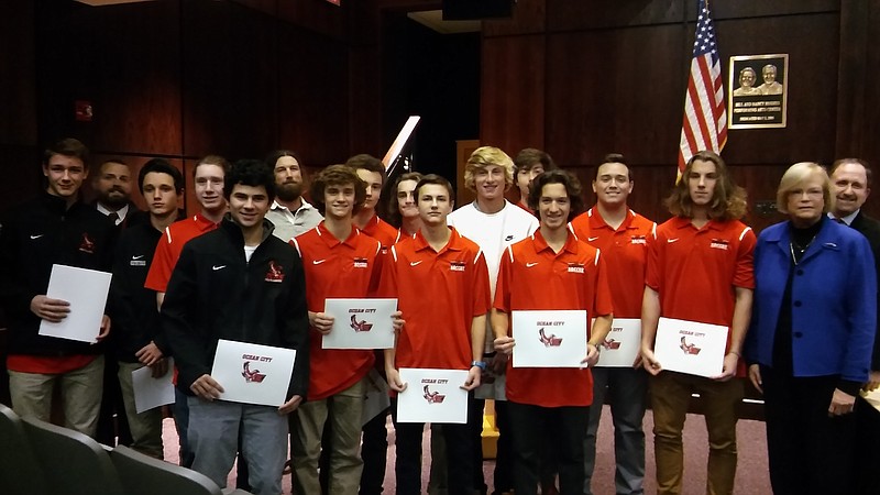 The boys soccer team received certificates for their achievements.