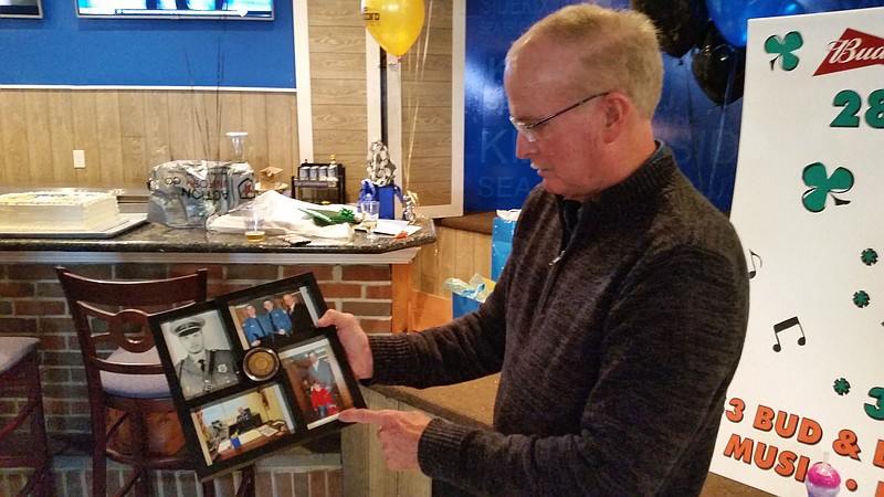 Schaffer reflects on his 45-year career in law enforcement while looking at old photos of himself.