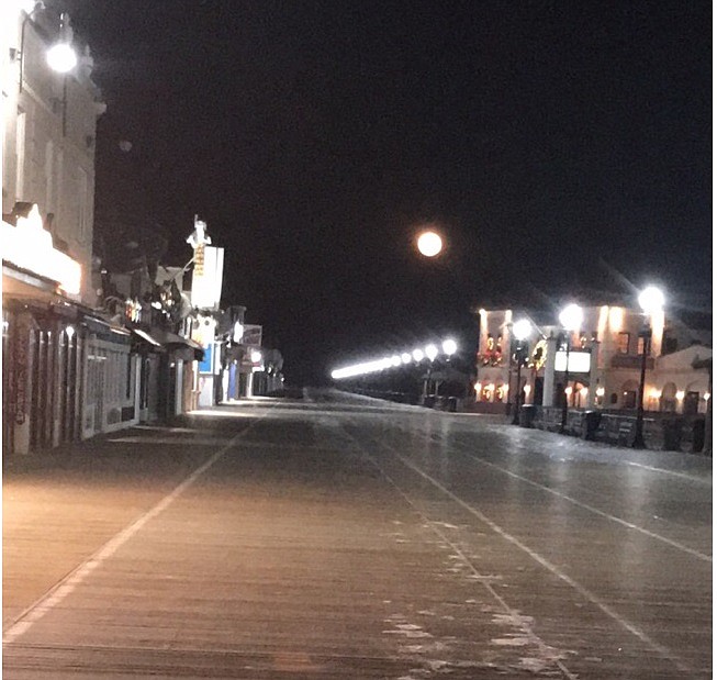 A full moon crowns the boardwalk Tuesday evening