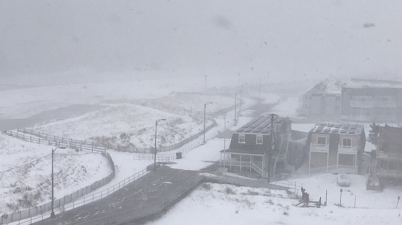 The Ocean City Boardwalk is barely visible as billzzard conditions persist 