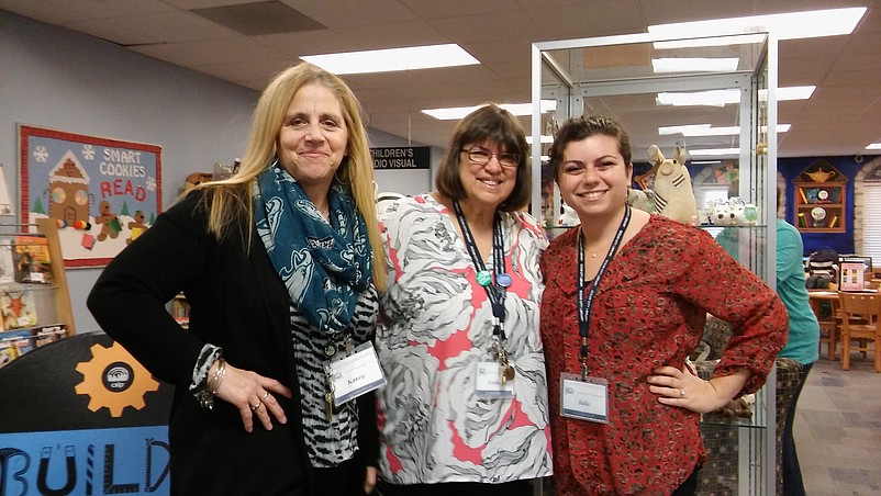 Library Director Karen Mahar with Assistant Library Director Leslie Clarke, retiring in December, and Adult Programming Librarian Julie Brown.