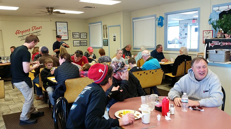 The quaint diner is packed with a lunchtime crowd.