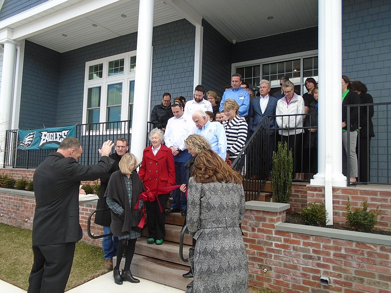 Rev. Peter Joyce of St. Maximillian Kolbe Parish in Marmora gives the benediction for the McMahon Insurance Agency ribbon cutting ceremony Friday.