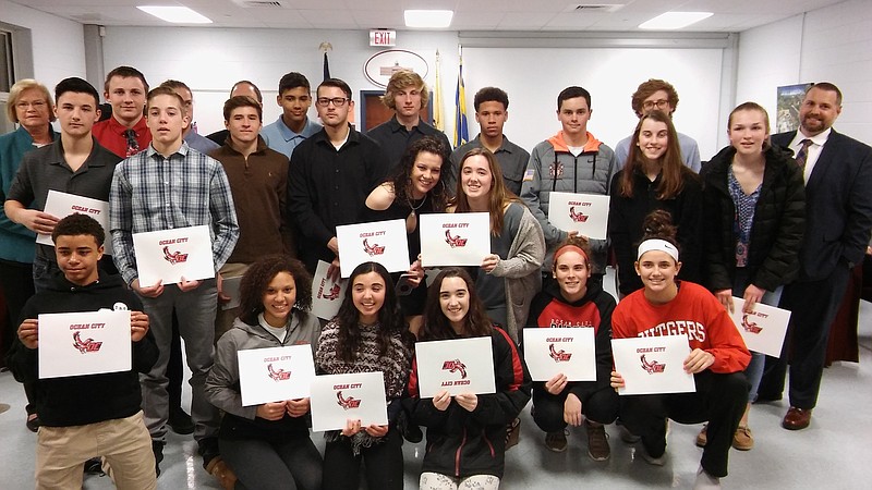 Ocean City School District winter sports athletes are honored at the school board meeting Monday night. Schools Superintendent Kathleen Taylor and Athletic Director Vince Leavey are also pictured.