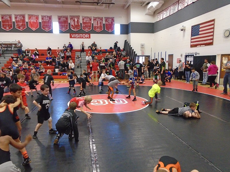 Wrestlers in the Tots and Bantam Divisions warm up Sunday afternoon.