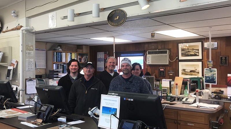 Dan Neil (third from left) gathers with employees recently.  From left are Ian Wallace, Harry Lord, Neil, Tim Yarger and Meg Moynihan.  