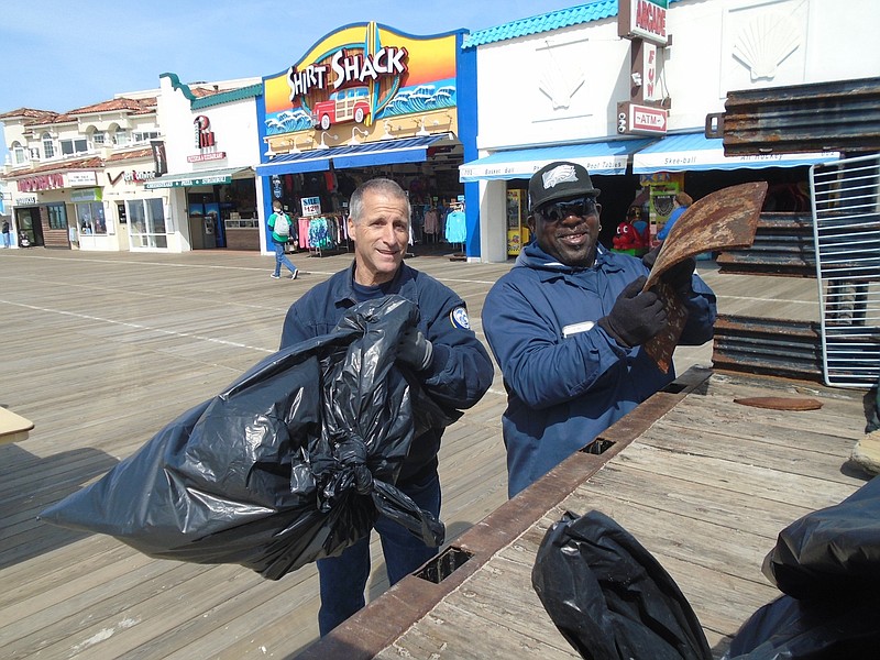 Public Works employees Philip Schreiber and Kevin Gale keep busy with the beach sweep. 