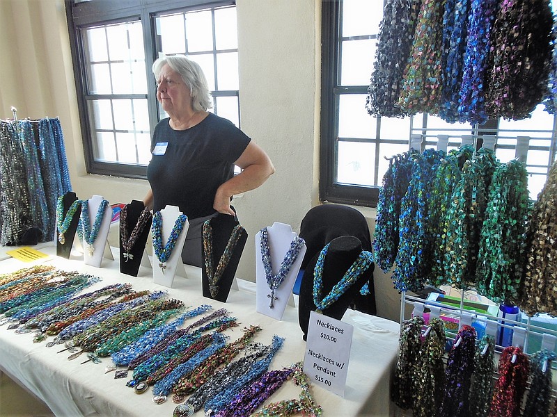 Ruth Deschler of Ruth's Fiber Arts helps customers. 