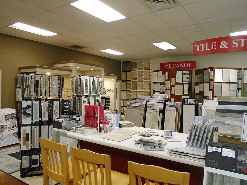 The showroom boasts 5,000 square feet of a vast selection from tiles to carpeting to wood and vinyl flooring.