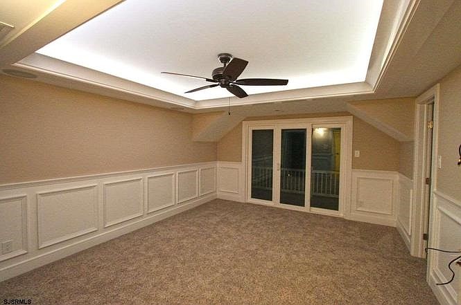 The home has spacious bedrooms, each with unique touches of tray ceilings and crown molding. (Courtesy John Giovanni Caccuitti)