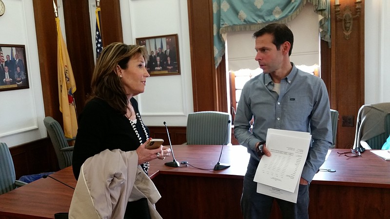 Michele Gillian, executive director of the Ocean City Regional Chamber of Commerce, and Wes Kazmarck, president of the Boardwalk Merchants Association, discuss the vacation app after a tourism meeting.