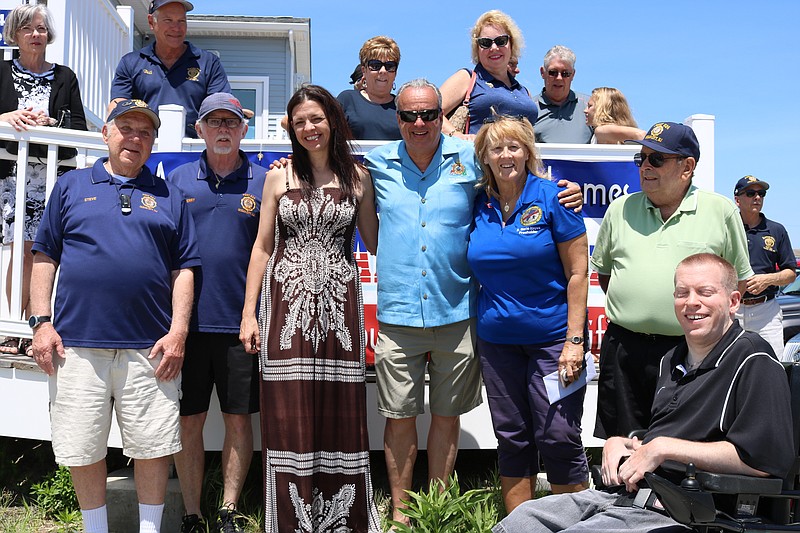 U.S. Army Reserve Capt. Joanne Schultze was honored by American Legion Post 524 in Ocean City with a weeklong vacation that began Sunday. Schultze is pictured with Post 524 members, including to her right, Steve Cole and Jerry Bonner. Councilman Keith Hartzell (is to her left with Freeholder E. Marie Hayes and Councilman Bob Barr and another post member, along with crowd of supporters.