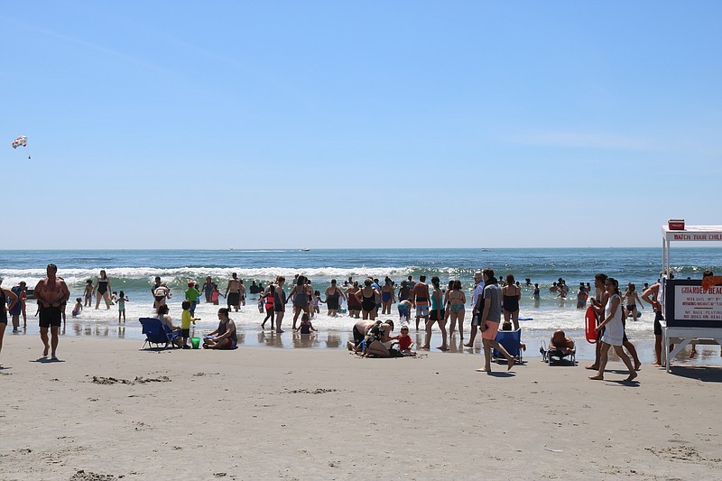 With steamy temperatures, beachgoers enjoyed the slight breeze at the water's edge. Proponents say they don't want the scent of smoke wafting through the air.