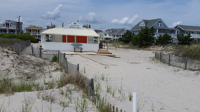 Before it gains final possession of the easement and builds the dune, the city plans to reinforce the protective berm surrounding the restaurant.