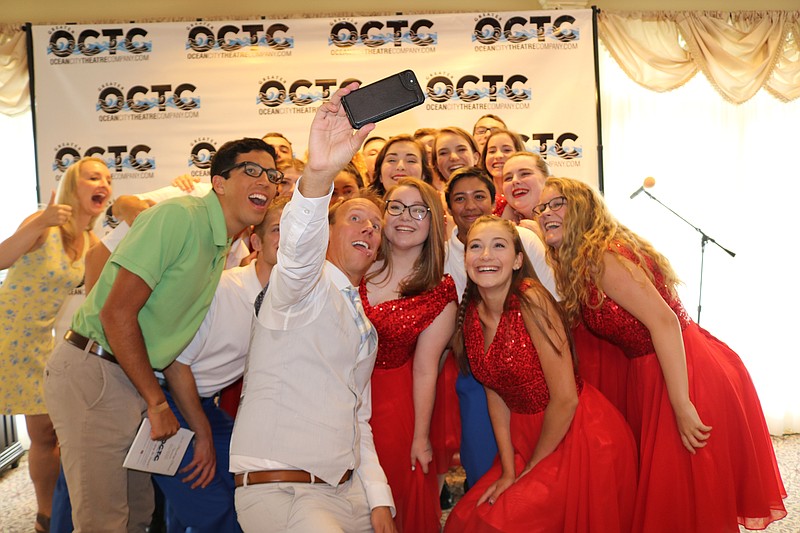 Good times are apparent as members of the OCTC and founder Michael Hartman pose for a selfie in 2018 at the annual brunch.