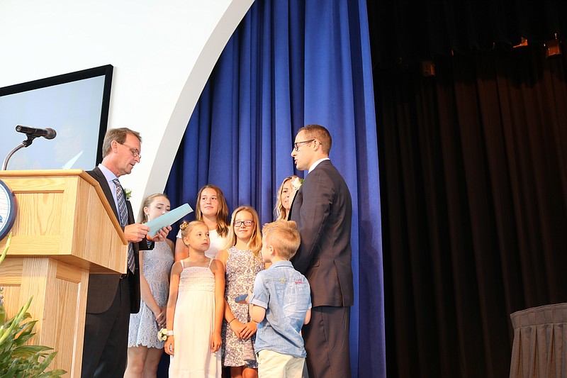 Mayor Jay Gillian swears in Council President Peter Madden with wife Ashley and children Carter, Riley, Avery, Brynn and niece Allie Kreisman.